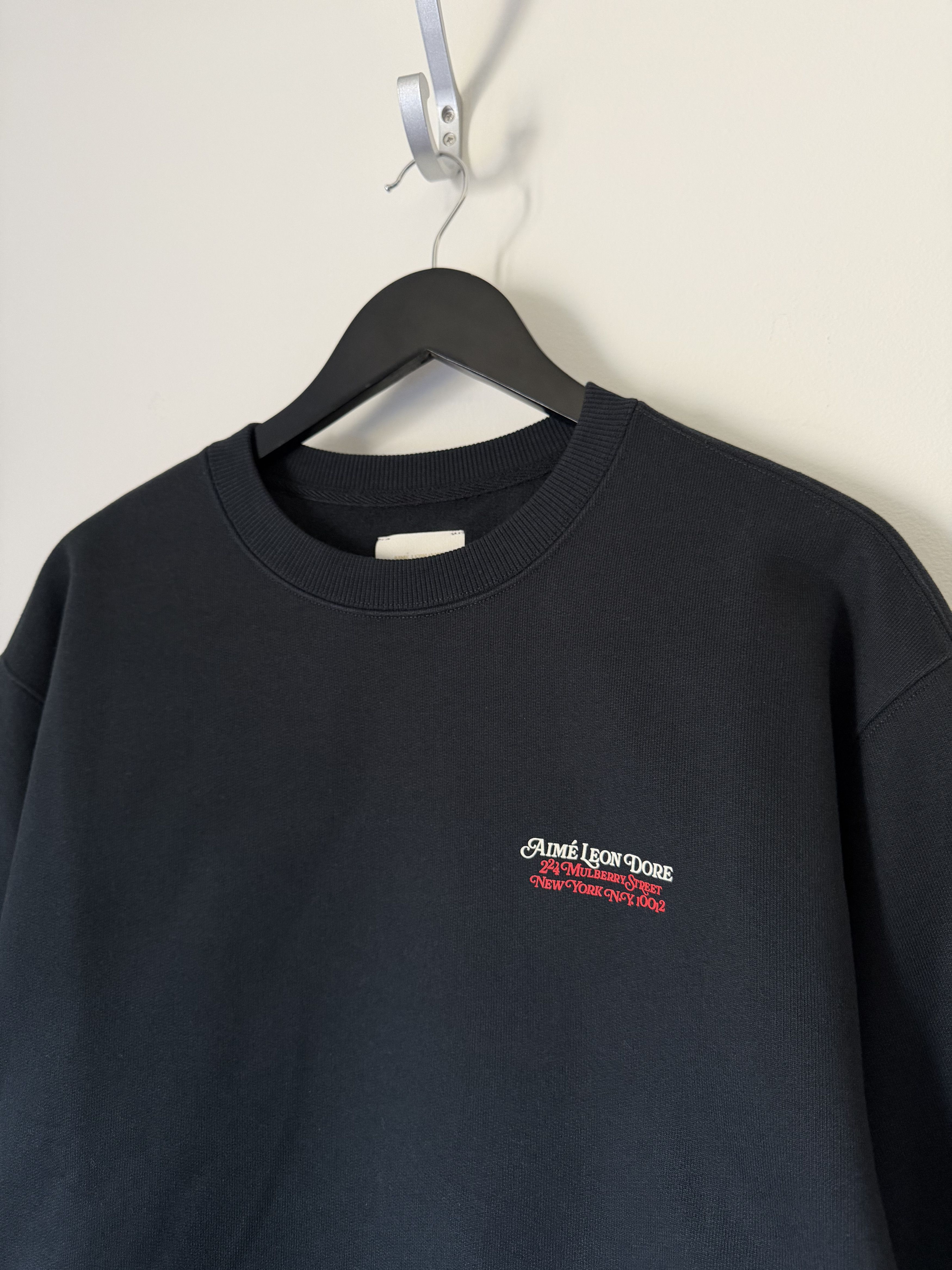 Leon Dore Aime Leon Dore Monogram Crewneck Sweatshirt In Black T-Shirts, Hoodie | PodTeesHub.com