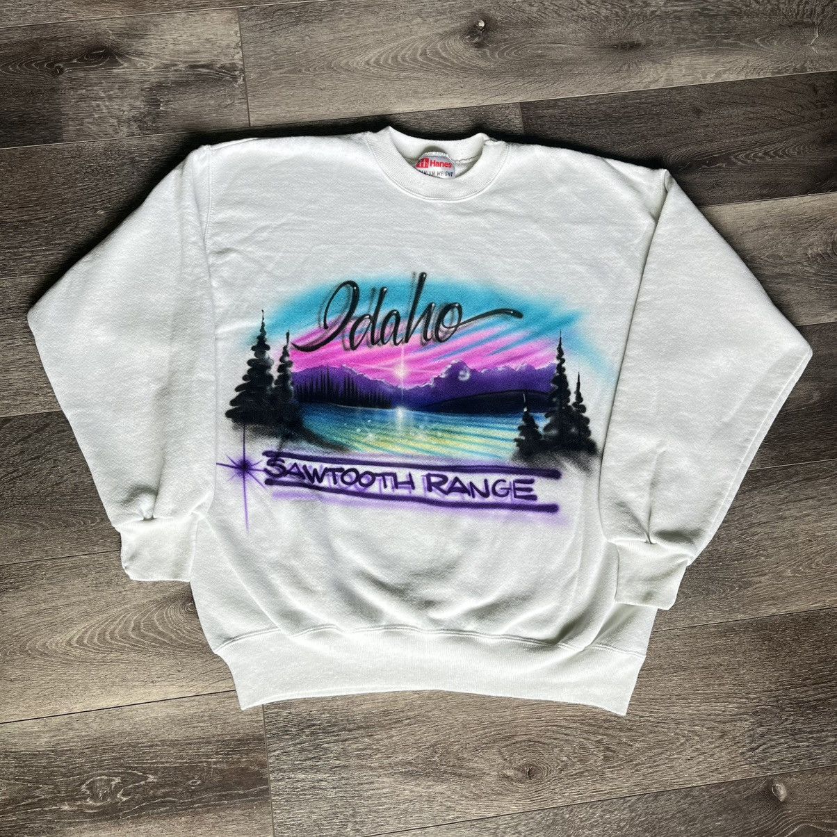 Vintage 1990s Idaho Sawtooth Range Airbrush Graphic Crewneck T-Shirts, Hoodie, Sweatshirt | PodTeesHub.com