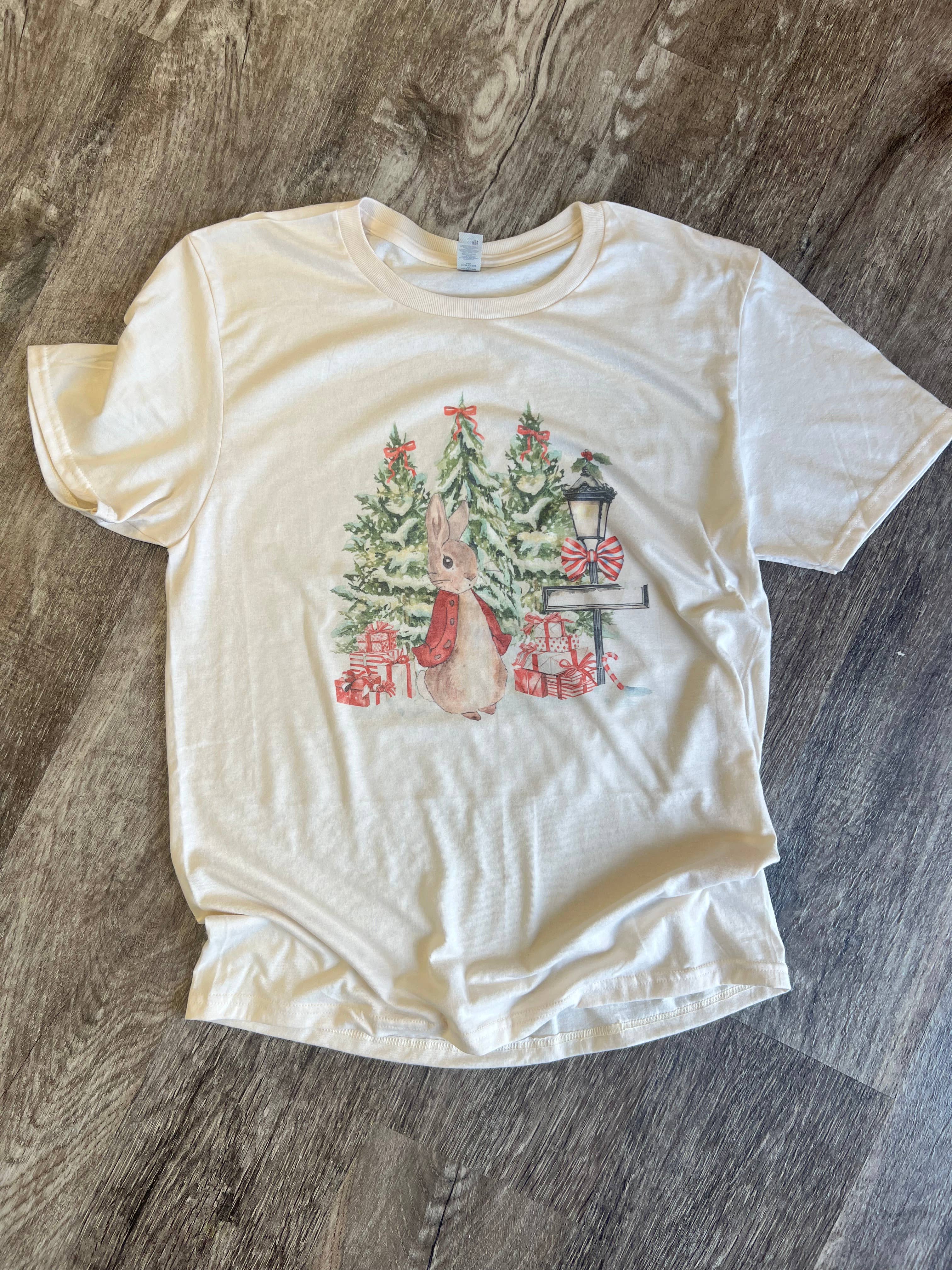 Christmas Bunny with Trees and Presents On Cream Tee Hoodie, Sweatshirt | PodTeesHub.com