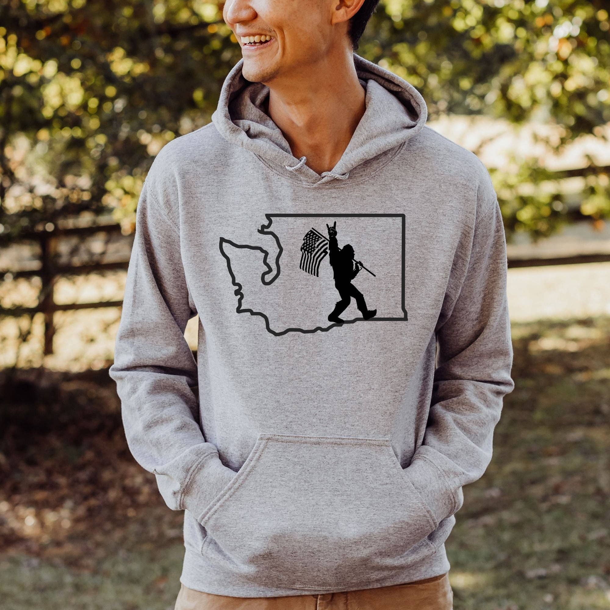 Bigfoot with Flag in Washington Sweatshirt *Unisex Fit* T-Shirts, Hoodie | PodTeesHub.com