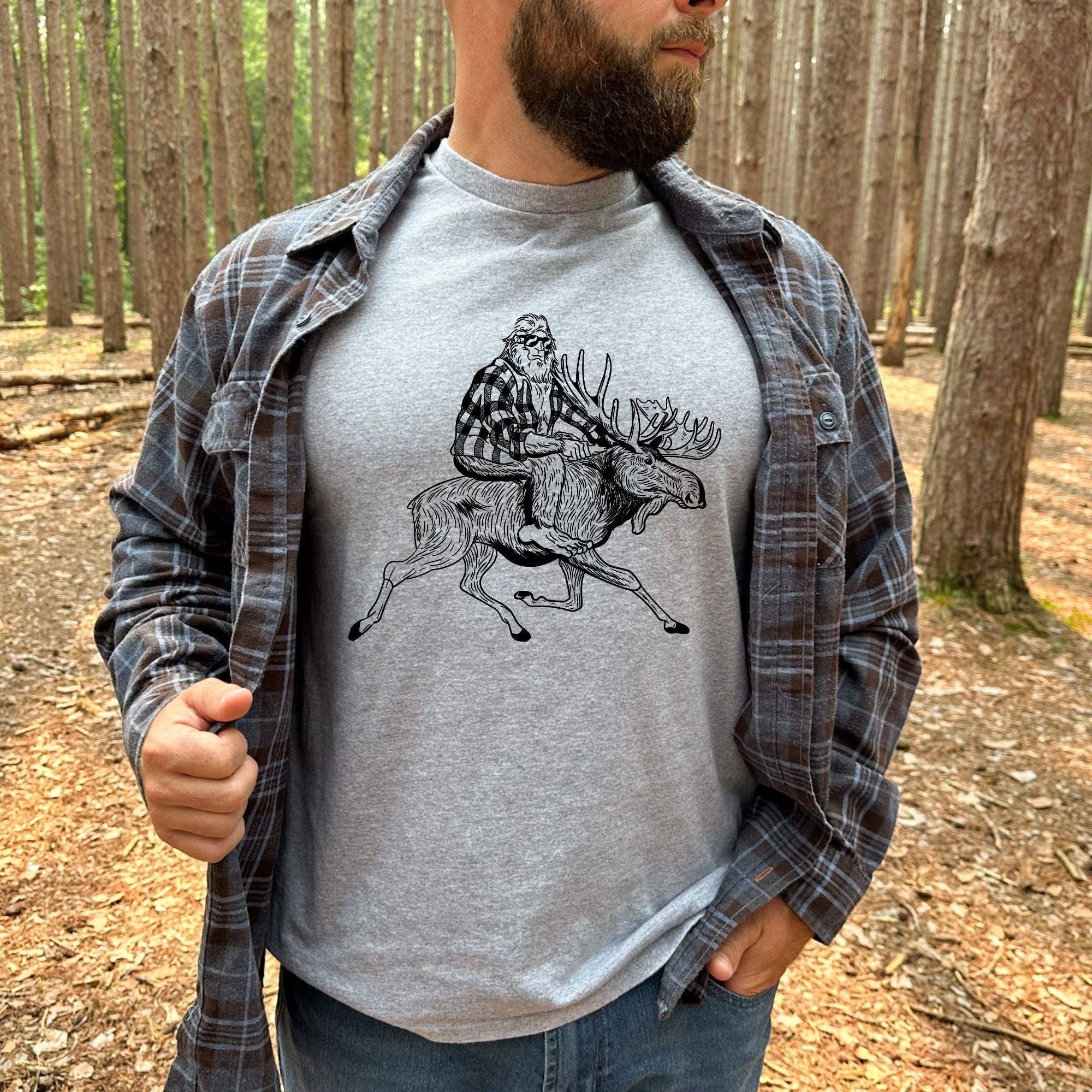 Bigfoot Riding A Moose Shirt For Men *Unisex Fit*213 Hoodie, Sweatshirt | PodTeesHub.com