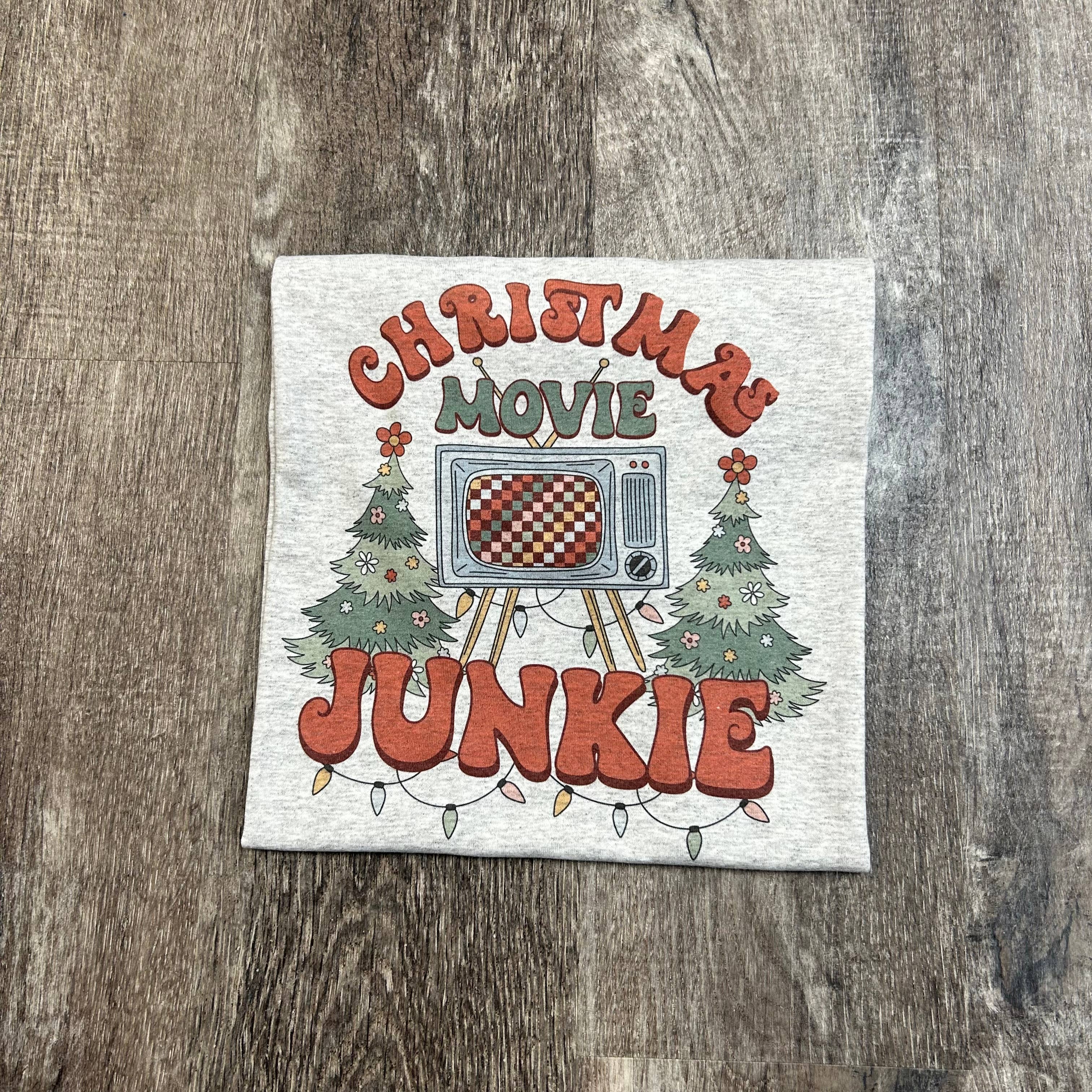 Christmas Movie Junkie On Ash Gray Tee Hoodie, Sweatshirt | PodTeesHub.com