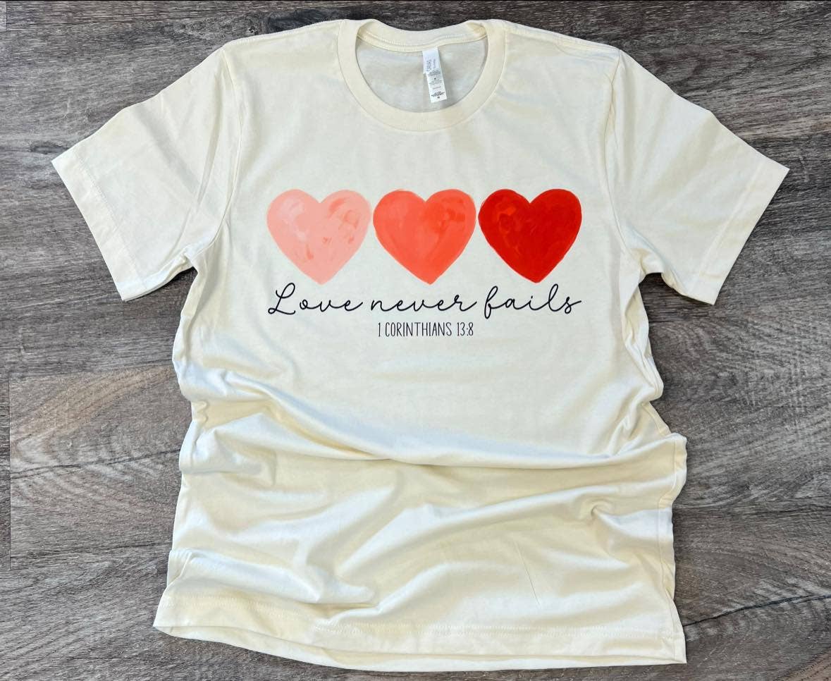 Love Never Fails On Bella+Canvas Natural Tee Hoodie, Sweatshirt | PodTeesHub.com