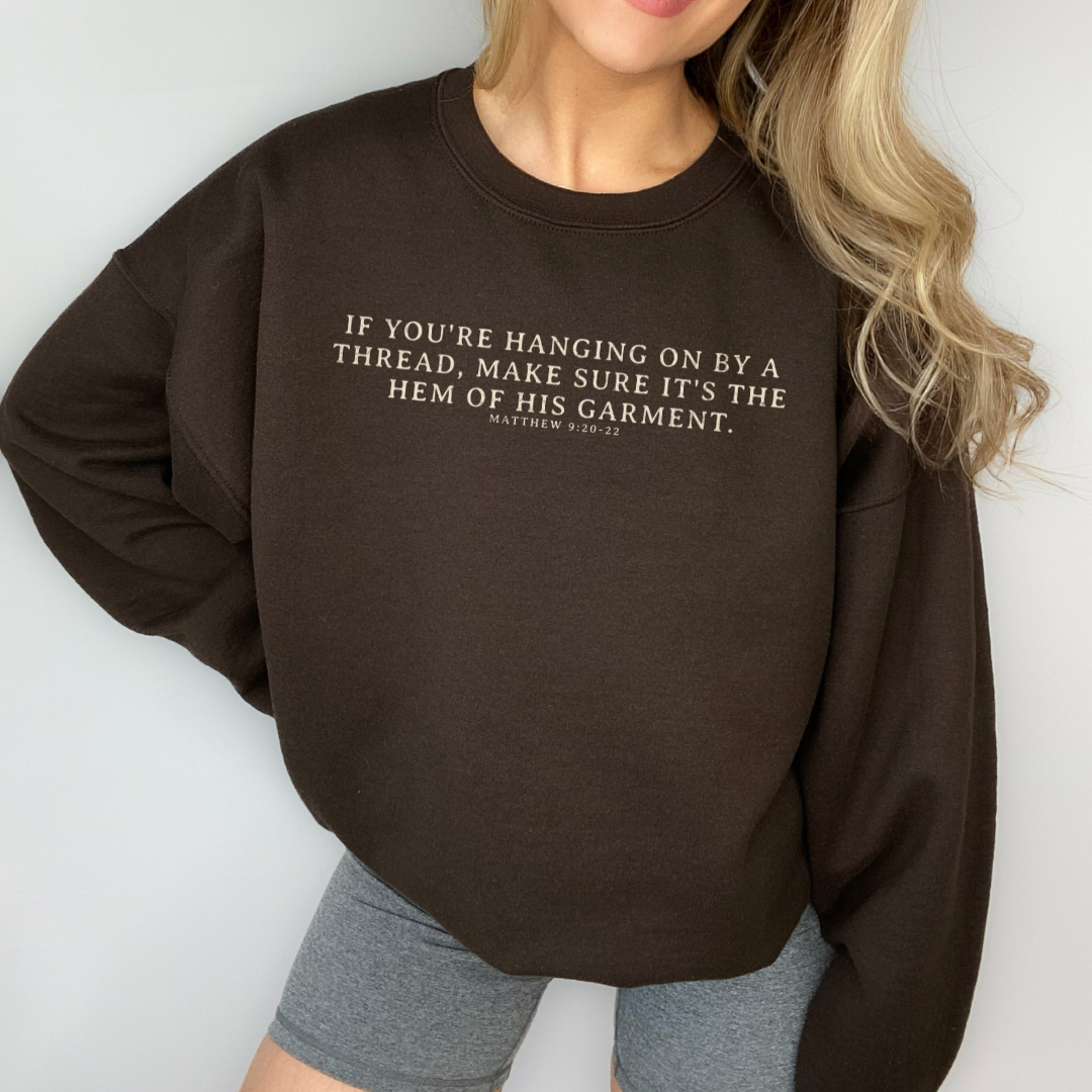 Hanging On By the Hem of His Garment Christian Sweatshirt T-Shirts, Hoodie | PodTeesHub.com