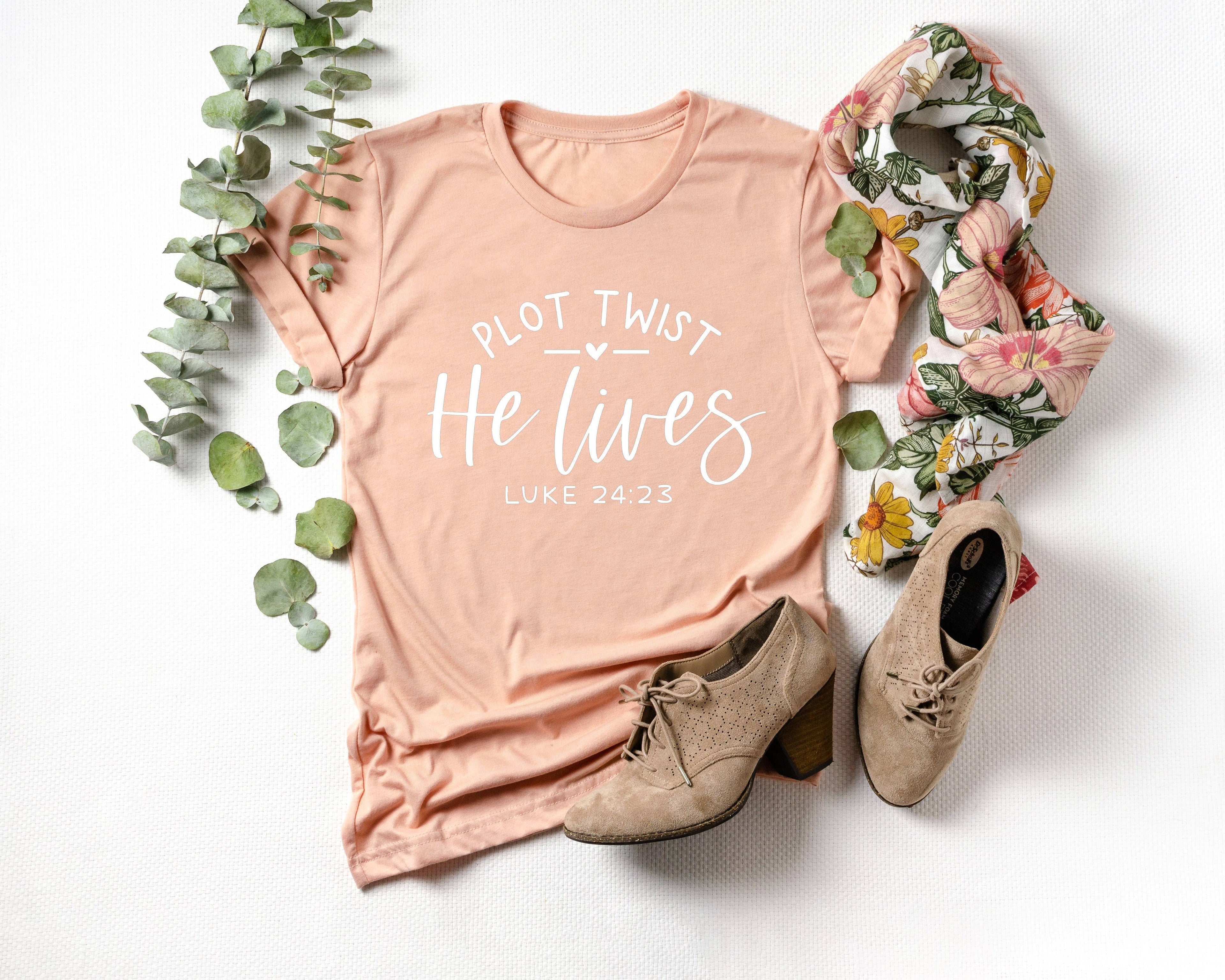 Plot Twist He Lives Easter Graphic Tee Women's Tees Religous Hoodie, Sweatshirt | PodTeesHub.com