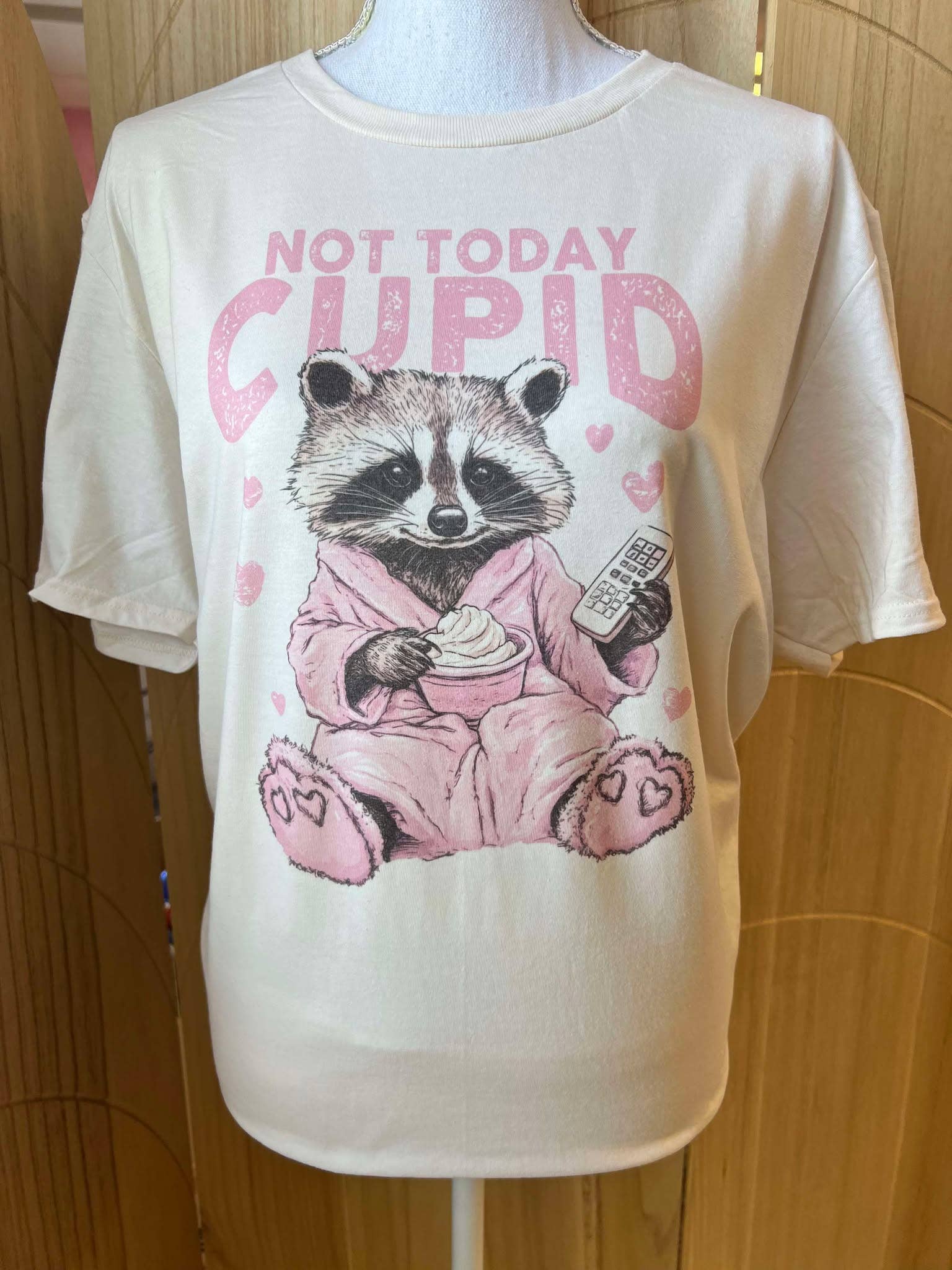 Not Today Cupid Raccoon - Valentine Tee On Cream Hoodie, Sweatshirt | PodTeesHub.com