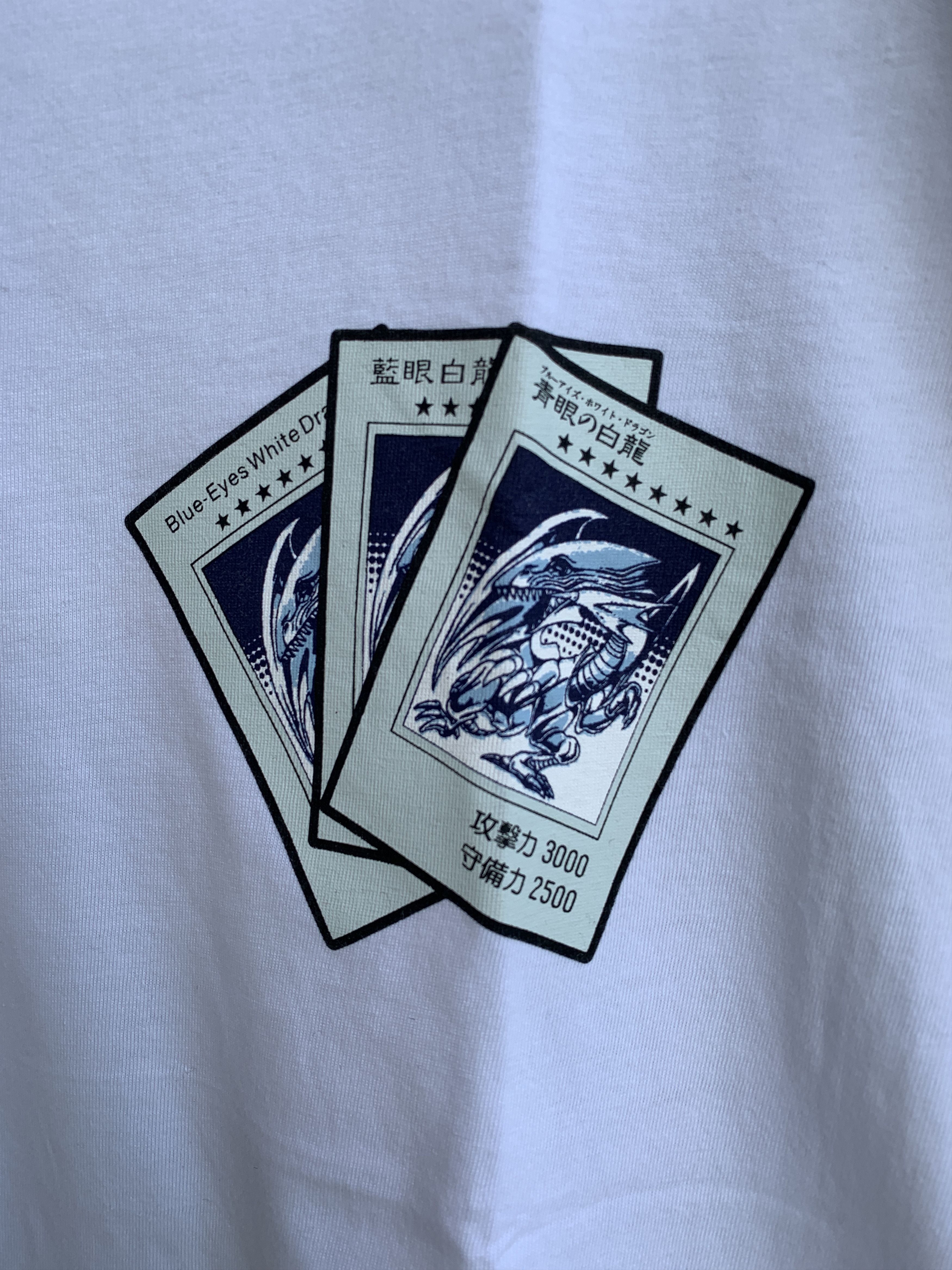 Japanese Brand X Uniqlo Uniqlo Ut X 50th Shonen Yugioh Blue Eyes White Dragon T-Shirts, Hoodie, Sweatshirt | PodTeesHub.com