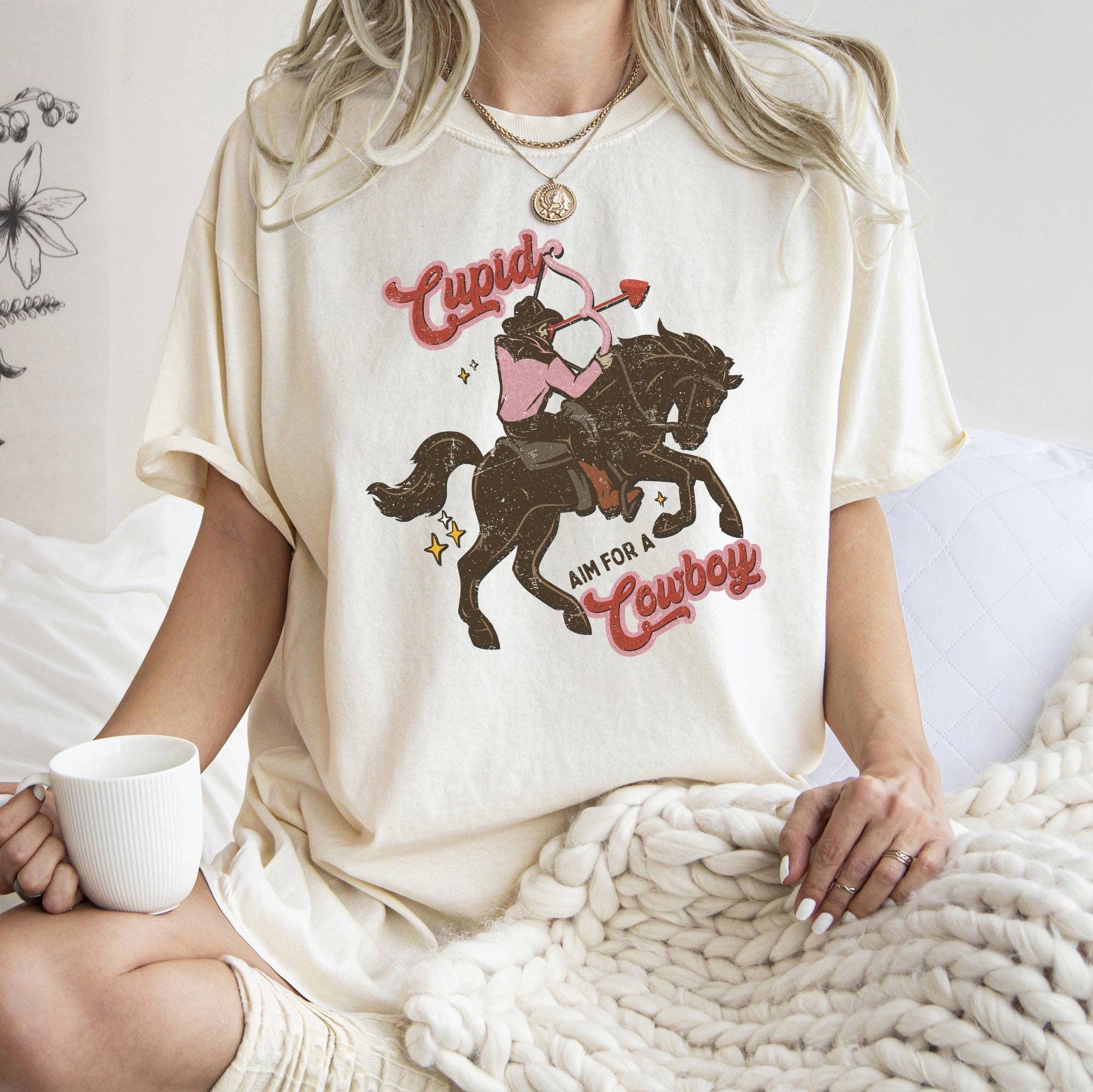 Cupid Aim For A Cowboy Comfort T-Shirt Hoodie, Sweatshirt | PodTeesHub.com