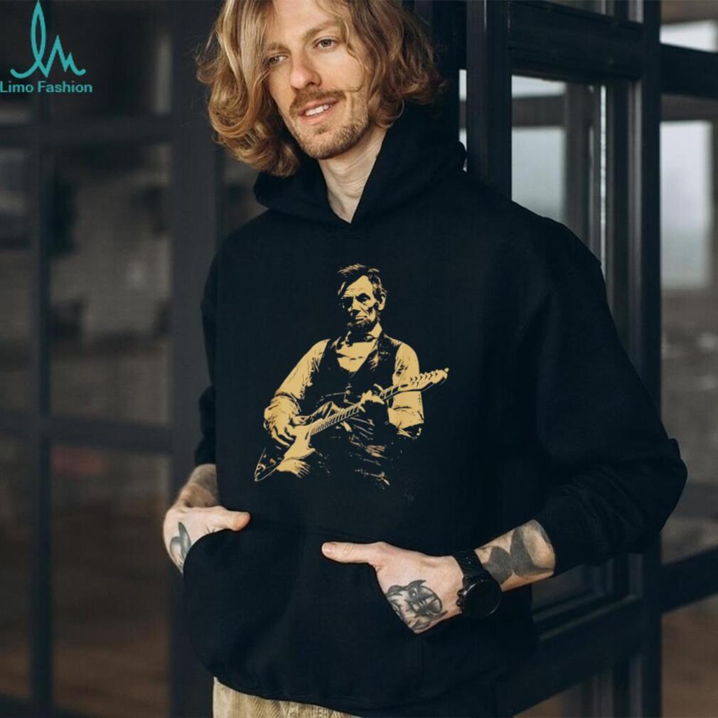 Abraham Lincoln playing electric guitar on a black cotton crew neck unisex shirt
