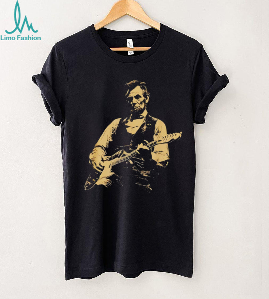 Abraham Lincoln playing electric guitar on a black cotton crew neck unisex shirt
