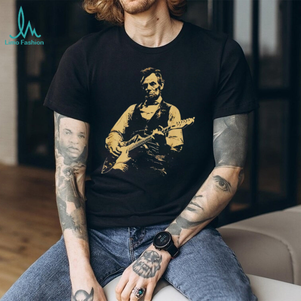 Abraham Lincoln playing electric guitar on a black cotton crew neck unisex shirt