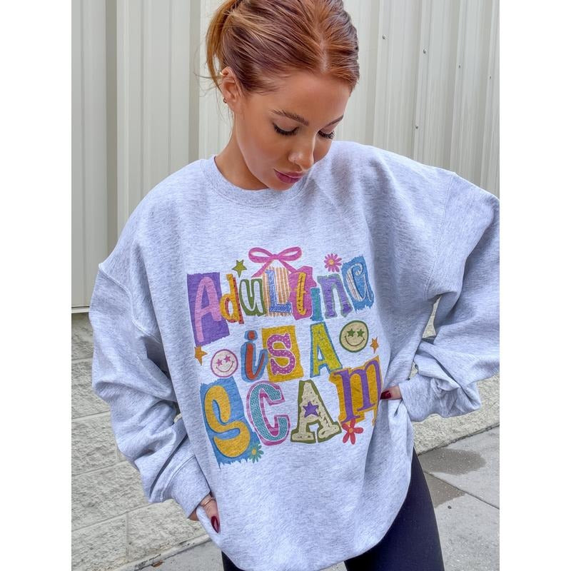 Adulting Scam Graphic Top T-Shirts, Hoodie, Sweatshirt | PodTeesHub.com