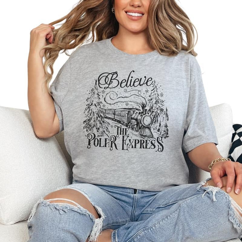Believe in the Polar Express Women's Long Sleeve Graphic Crewneck Tshirt Christmas Holiday Winter Shirt Casual Tops with...
