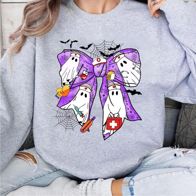 Bow Nurse Halloween Sweatshirt, Cute Iridescent Ghost Nurse T-Shirt, Pastel Gothic Nurse Top, Fun Halloween Nurse Gift,...