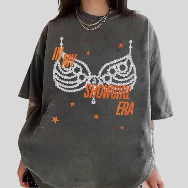 COMFORT COLORS In My Showgirl Era Shirt, Life of a Orange Show Girl T-Shirt. The "Glitter" on the shirt is a printed...