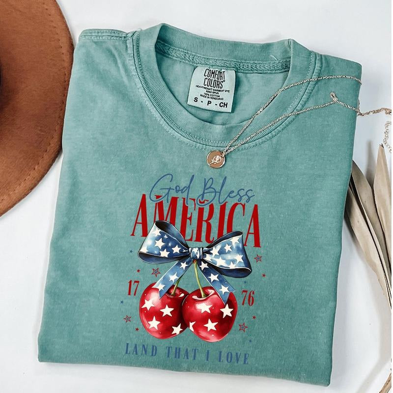 Comfort Colors God Bless America T-Shirt, Coquette Fourth of July Shirt, America Cherry Bow Tee, Usa Flag Shirt, Unisex...