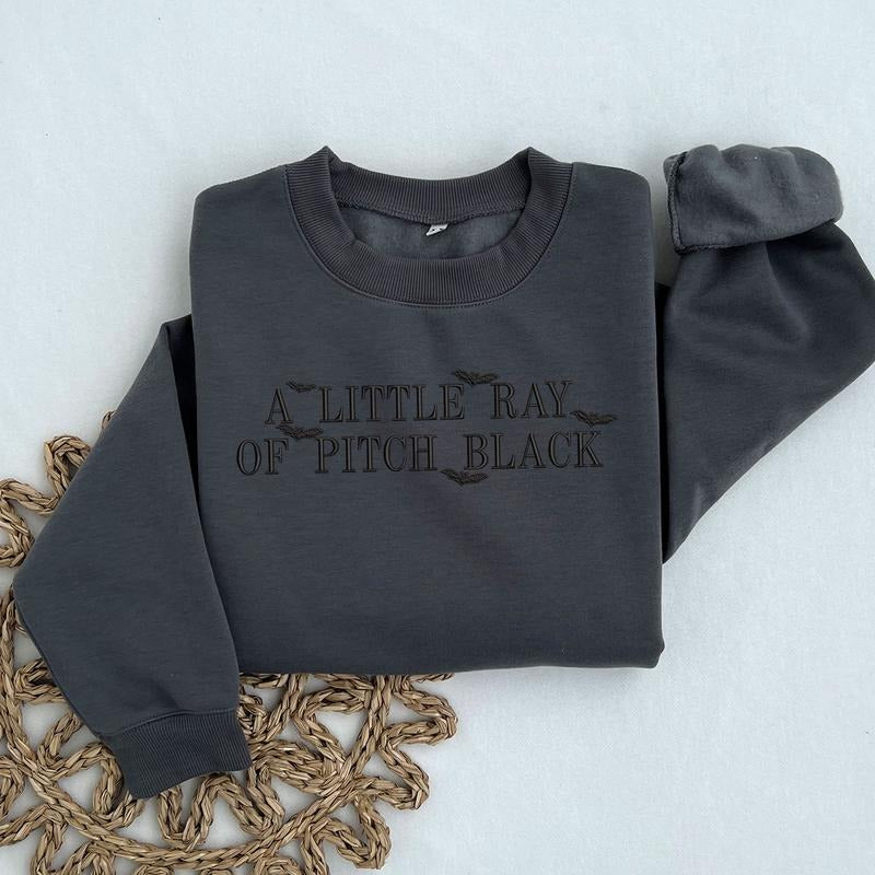 Embroidered "A Little Ray of Pitch Black" Sweatshirt - Dark Humor Halloween Crewneck T-Shirts, Hoodie | PodTeesHub.com