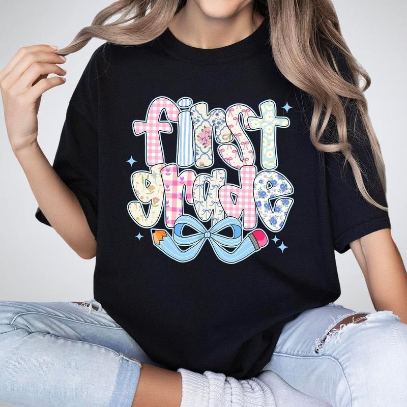 First Grade Coquette Teacher T-Shirt, 1st Grade Pencil Bow Graphic Tee, Pastel Floral Shirt for Teacher, Cute Pastel Back...