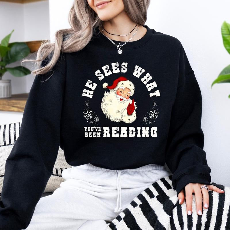He Sees What You've Been Reading Santa Sweatshirt, Funny Bookish Christmas Santa Hoodie, Book Lover Gift, Xmas...