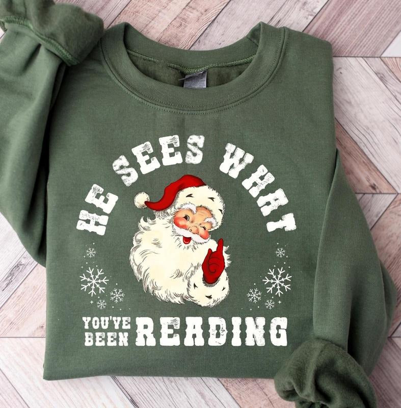 He Sees What You've Been Reading Santa Sweatshirt, Funny Bookish Christmas Santa Sweater, Book Lover Gift, Xmas...