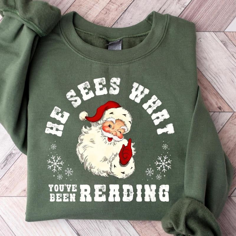 He Sees What You've Been Reading Santa Sweatshirt, Funny Bookish Christmas Santa T-shirt, Book Lover Gift, Xmas Hoodie,...