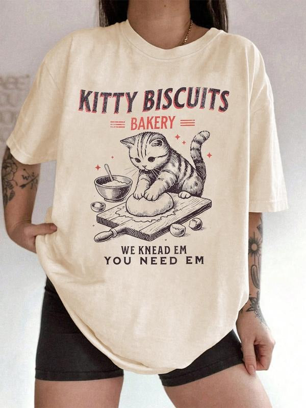 Unisex Funny Cat Bakery Graphic T-Shirt with "We Knead Em You Need Em" Slogan, Kitty Biscuits Design for Pet Lovers and...