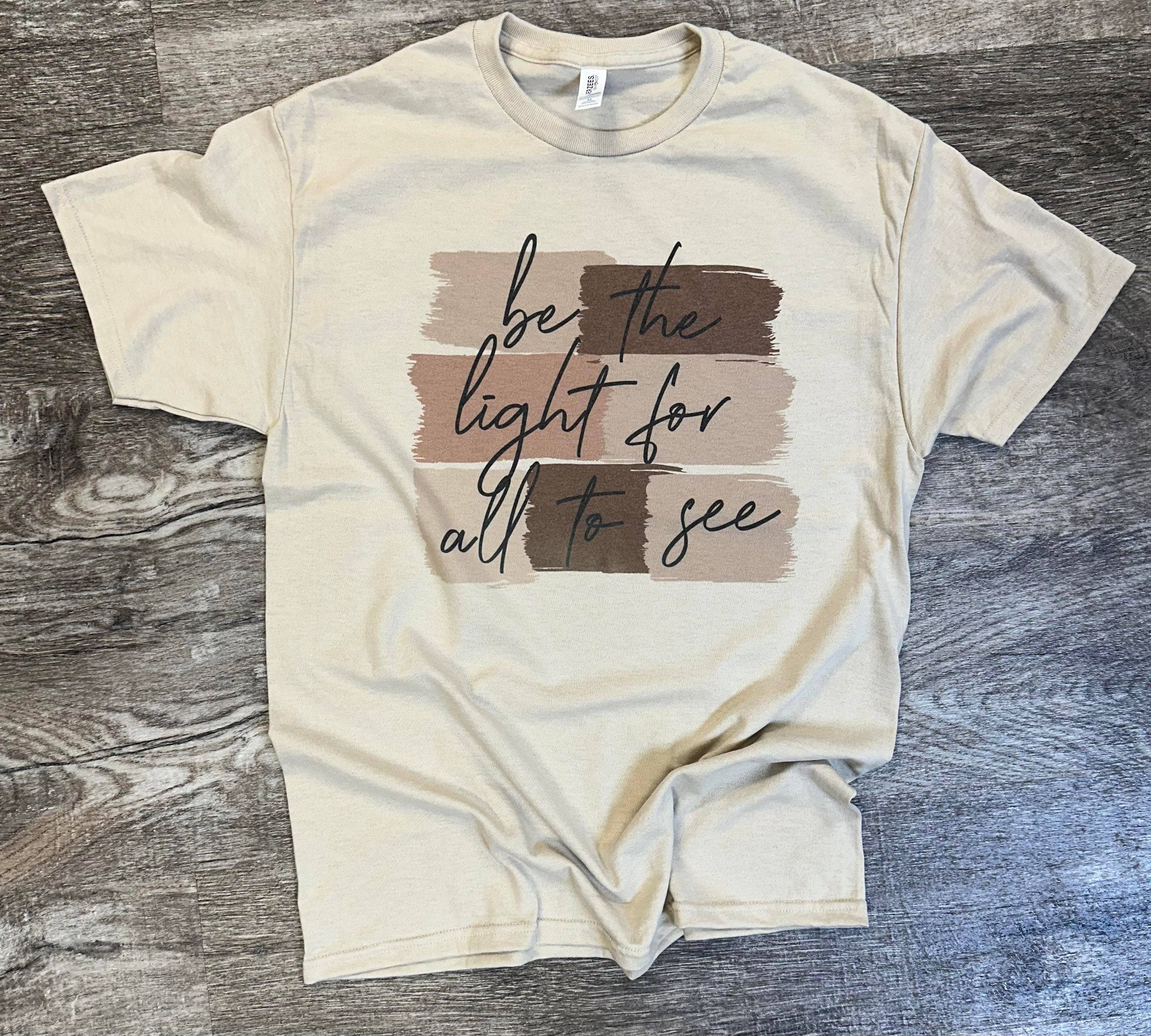 Be the Light For All To See On Sand Tee Hoodie, Sweatshirt | PodTeesHub.com