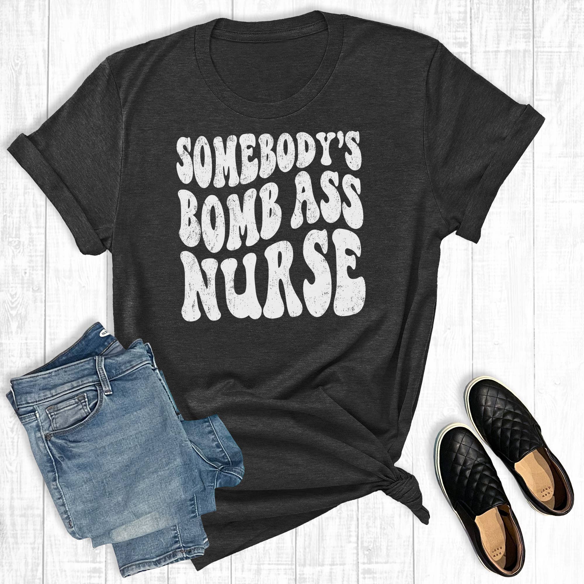Somebody's Bomb Ass Nurse Graphic Tee Hoodie, Sweatshirt | PodTeesHub.com