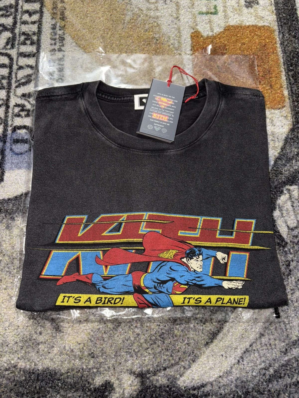 Kith X Ronnie Fieg Kith X Superman It S A Bird Vintage Tee Black Hoodie, Sweatshirt | PodTeesHub.com