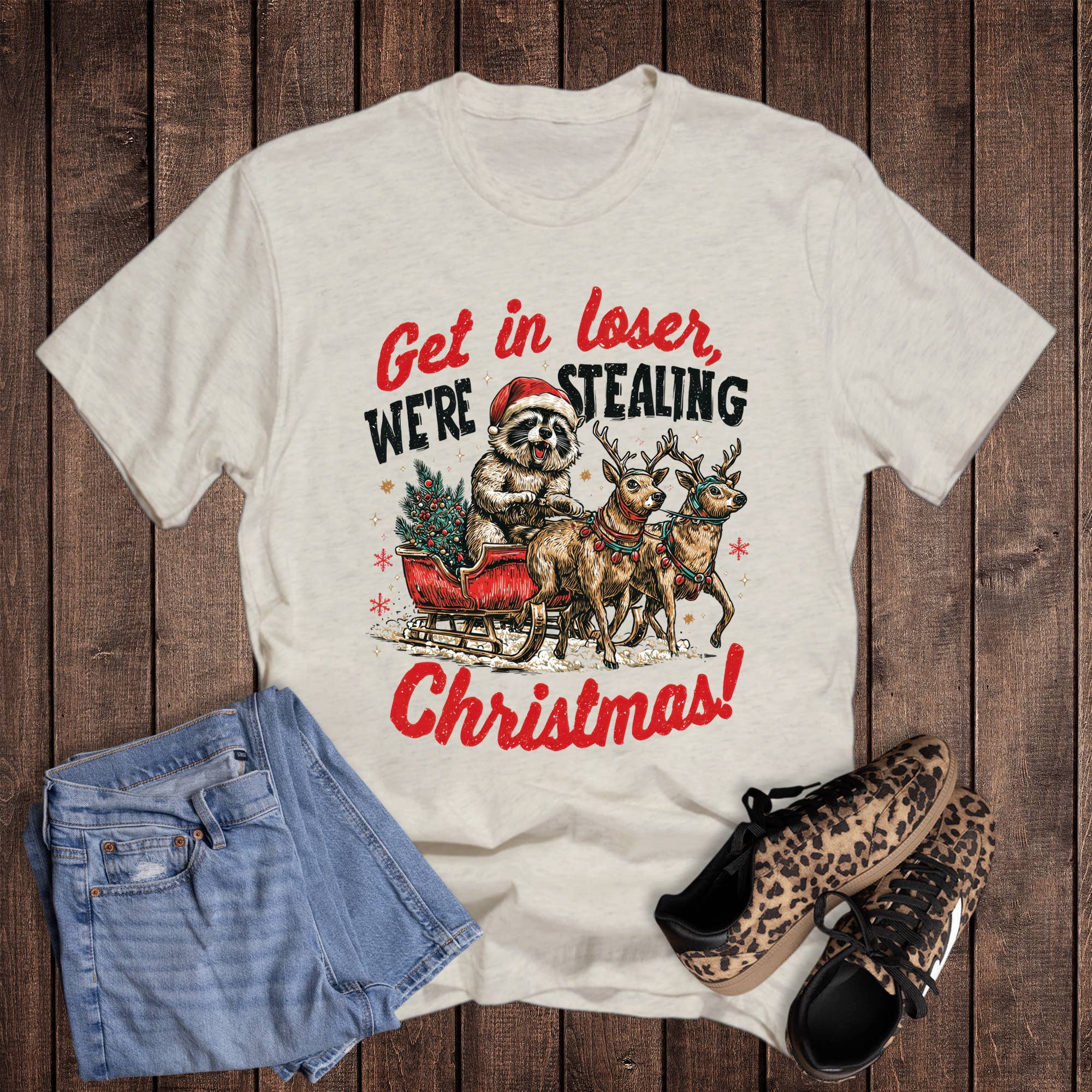 Christmas Raccoon Stealing Christmas Graphic Tee Hoodie, Sweatshirt | PodTeesHub.com