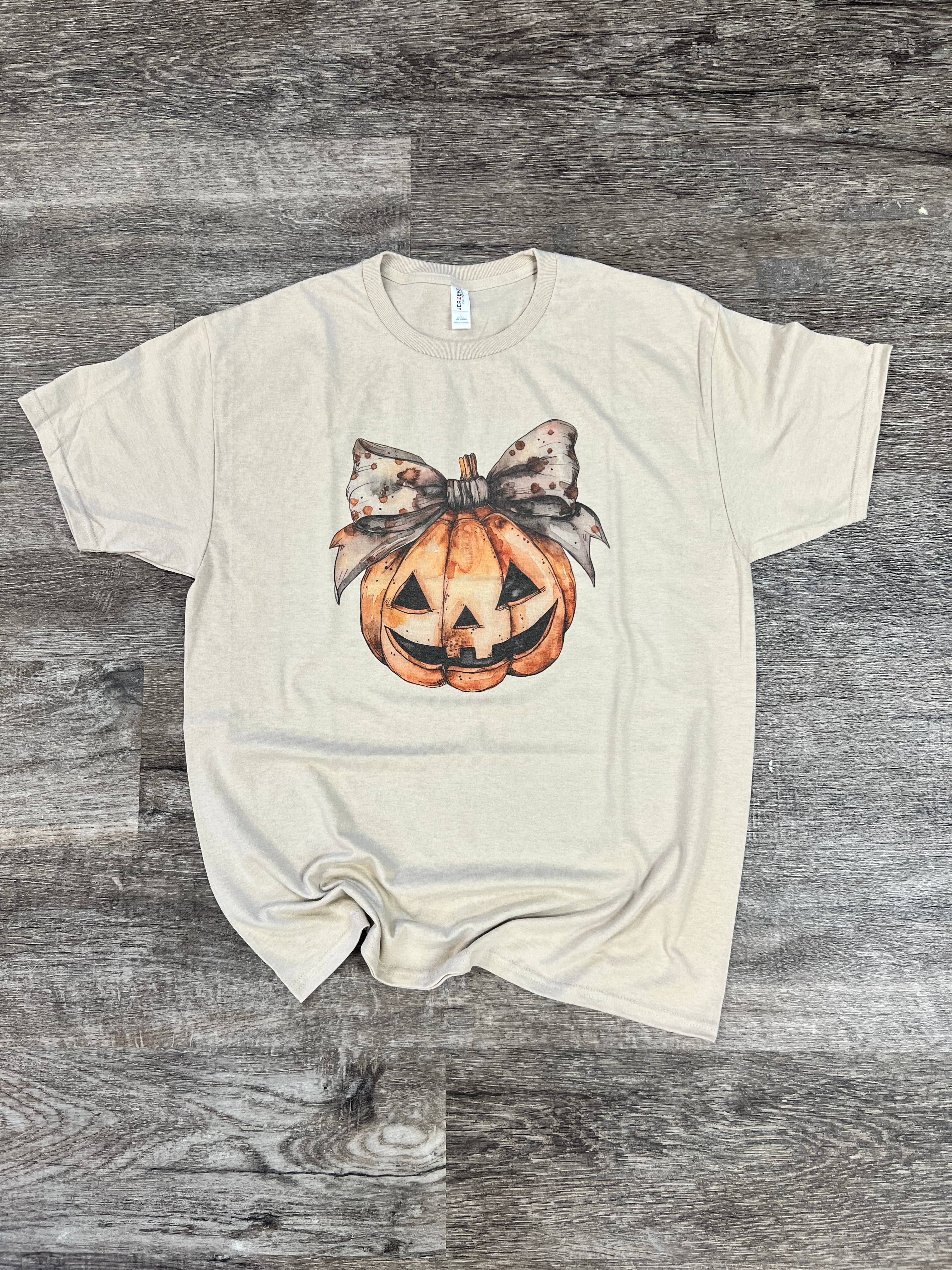 Smiling Pumpkin with Vintage Bow On Sand Tee Hoodie, Sweatshirt | PodTeesHub.com