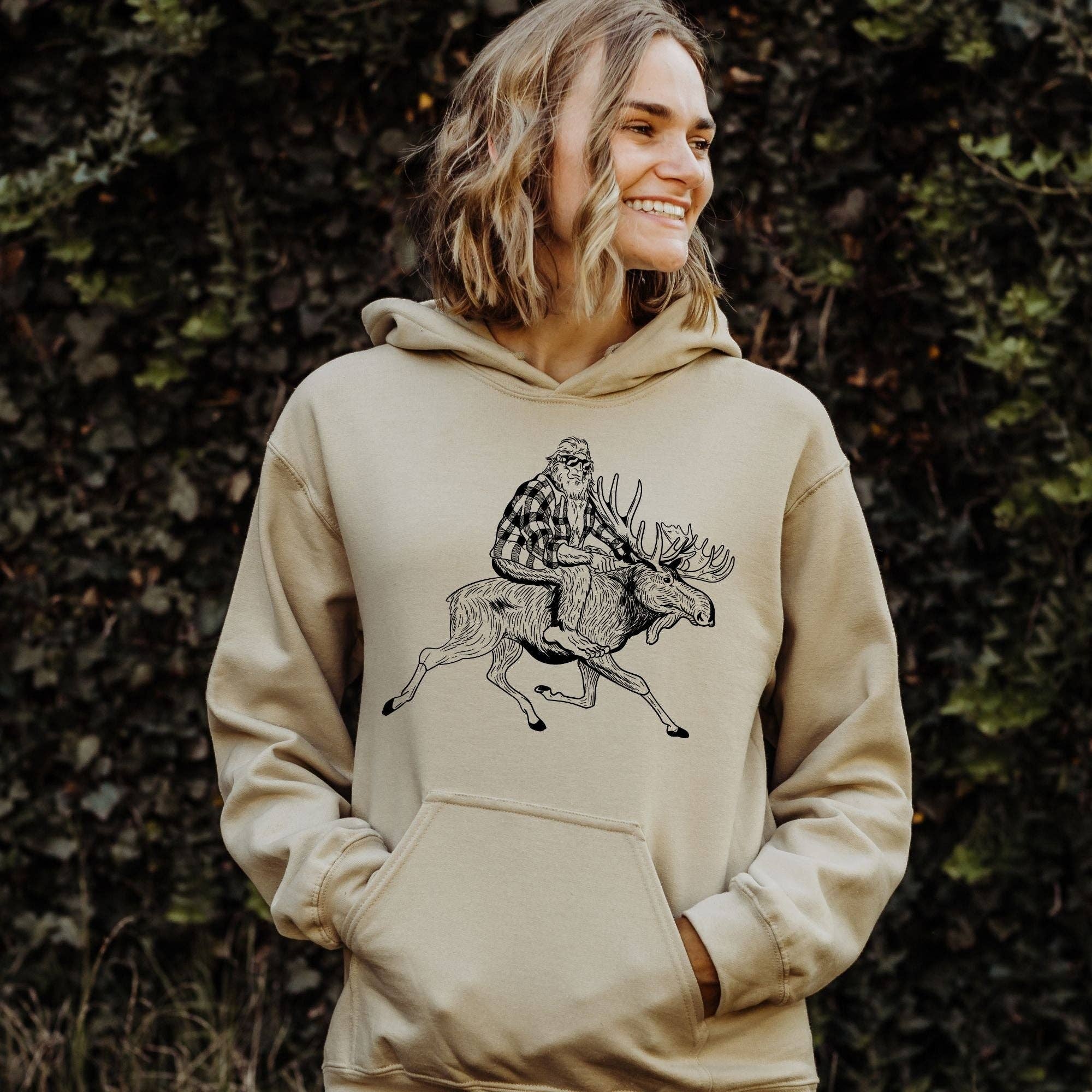 Bigfoot Riding Moose Crewneck Sweatshirt Unisex Fit T-Shirts, Hoodie | PodTeesHub.com