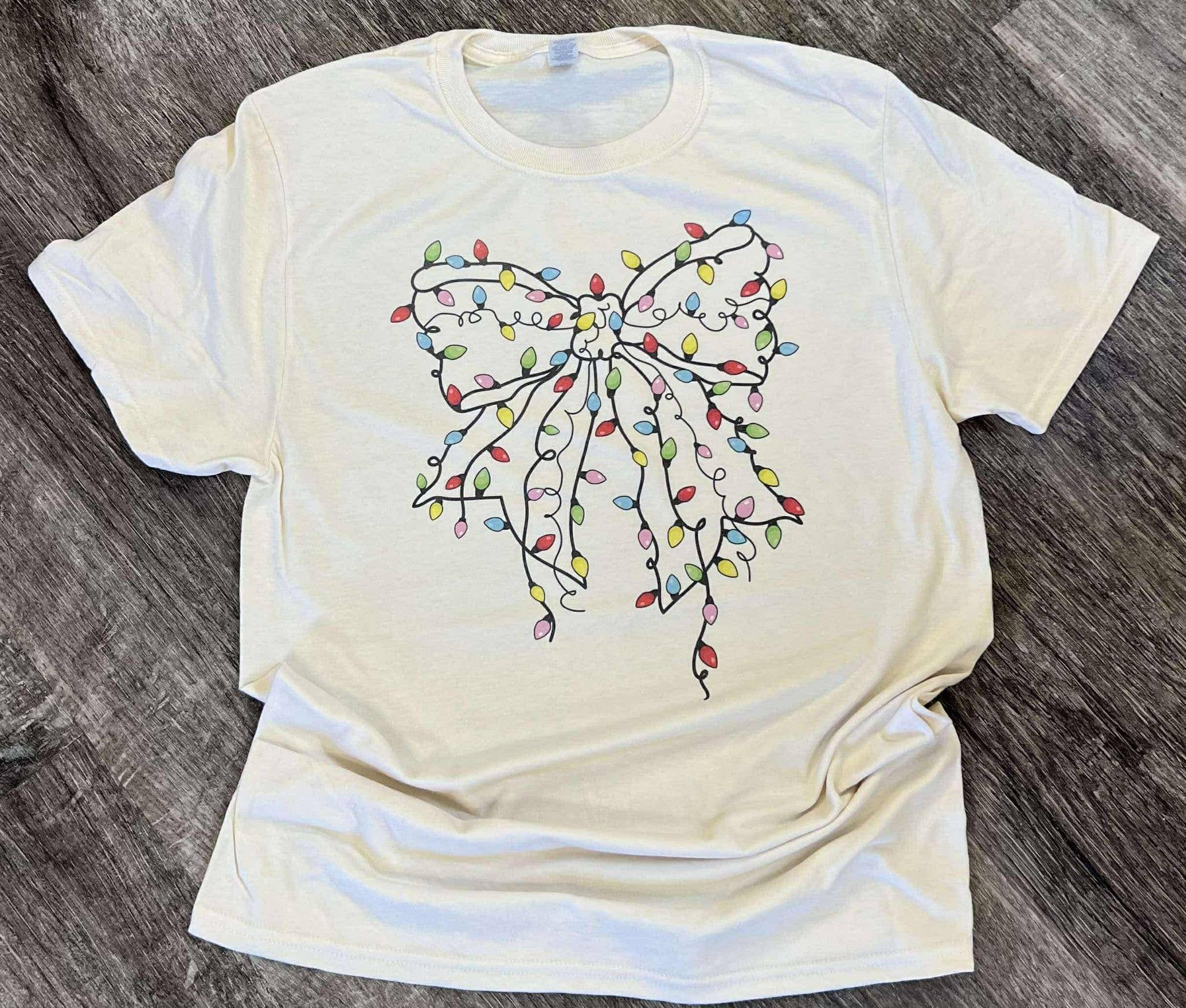 Christmas Tree Lights Bow On Cream Tee Hoodie, Sweatshirt | PodTeesHub.com