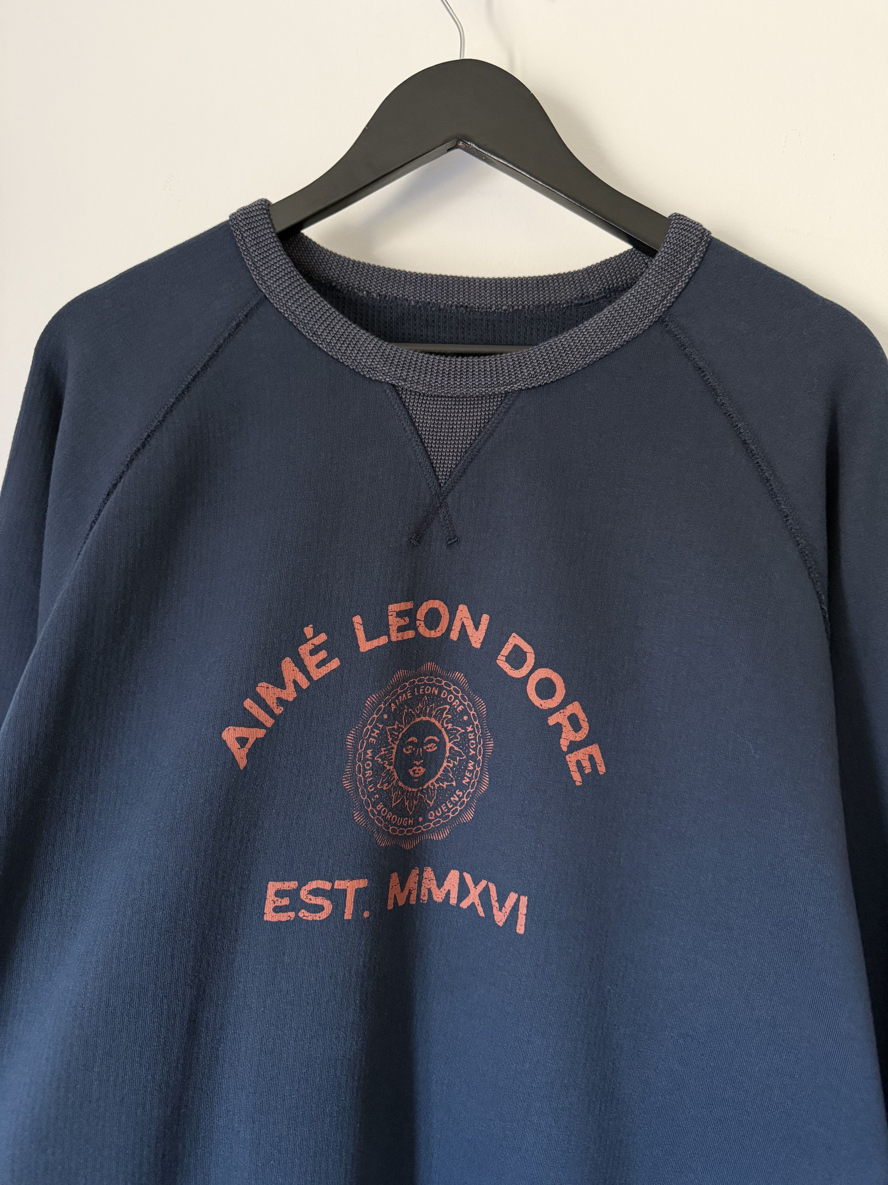 Leon Dore Aime Leon Dore Souvenir Crewneck Sweatshirt In Sky Captain T-Shirts, Hoodie | PodTeesHub.com