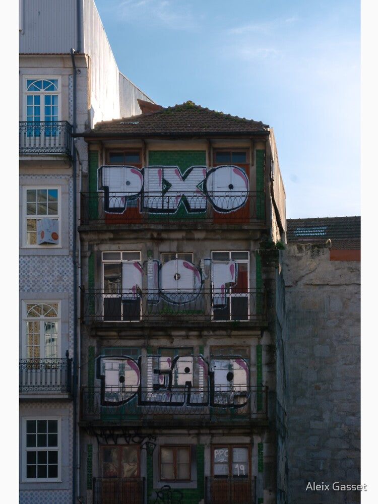 Urban graffiti on an old building with a protest message - “PIXO NOT DEAD” by Aleix Gasset