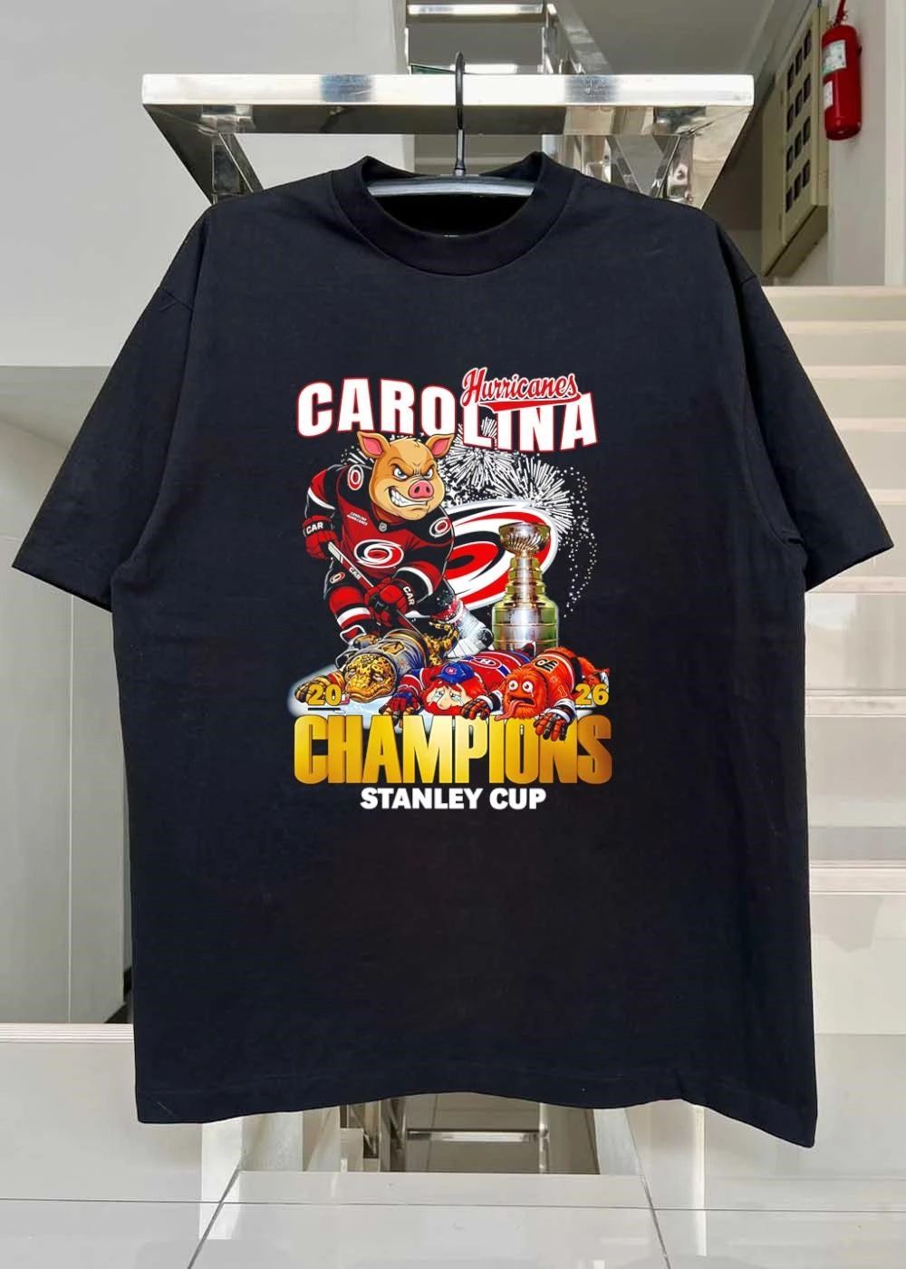 2026 Champions Carolina Hurricanes Mascot Defeating Rivals Stanley Cup T-Shirt