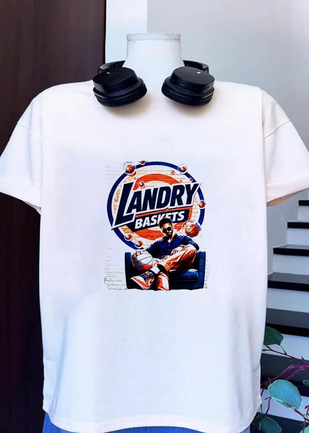 Landry Baskets Stylish Man Sitting with Basketball Graphic T-Shirt