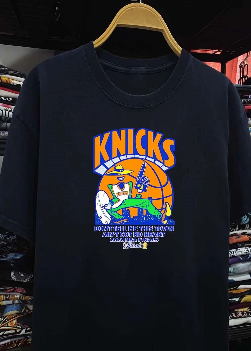 Knicks Apparel ‘ Mascot Holding Foam Finger ‘ Don’t Tell Me This Town Ain’t Got No Heart 2026 NBA Finals Knicks T-Shirt