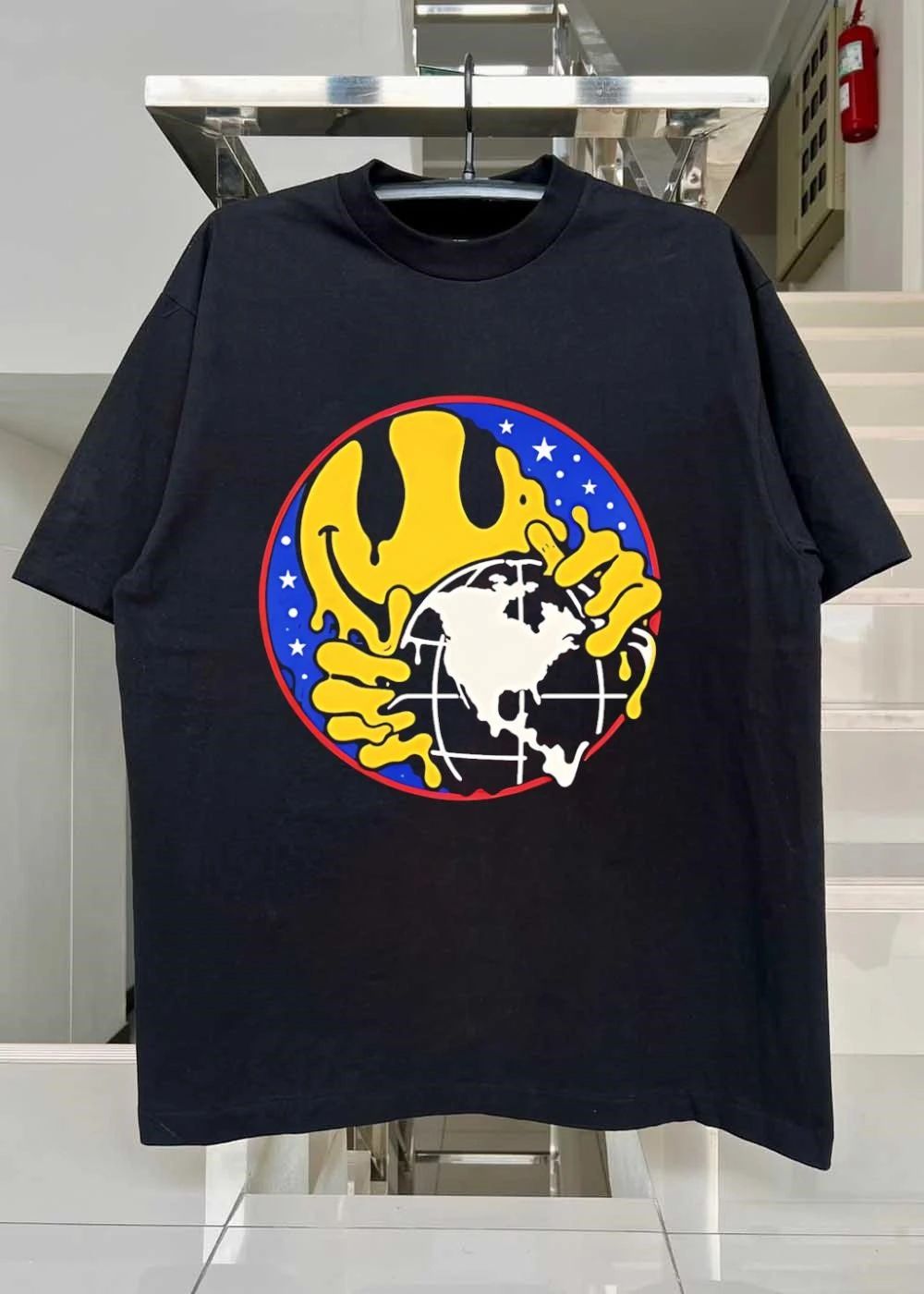 Melting Smiley Holding Globe T-Shirt