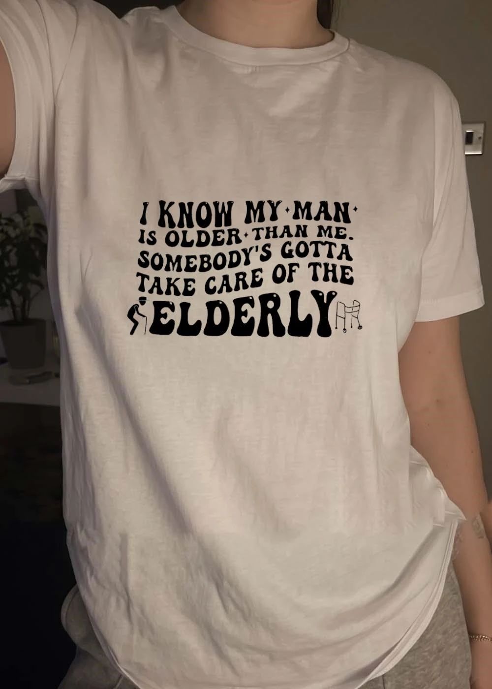 Funny Humor I Know My Man Is Older Than Me Somebody Gotta Take Care Of The Elderly T-Shirt