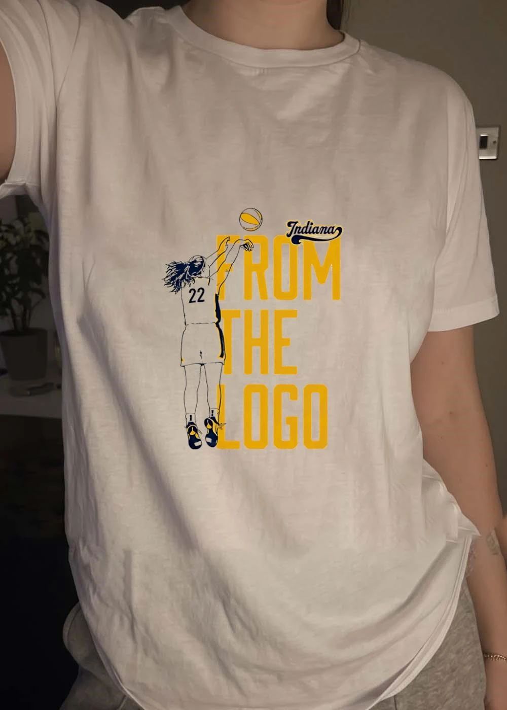 Indiana Basketball Player Jumping for Shot From the Logo Shirt