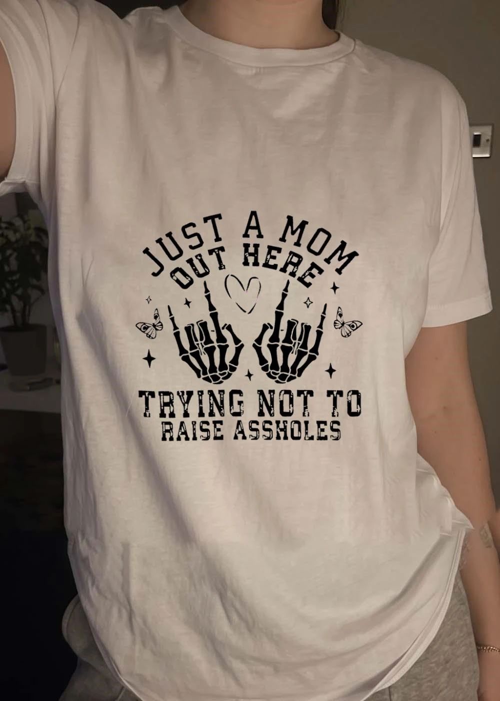Just a Mom Out Here Trying Not to Raise Assholes Skeleton Hands T-Shirt