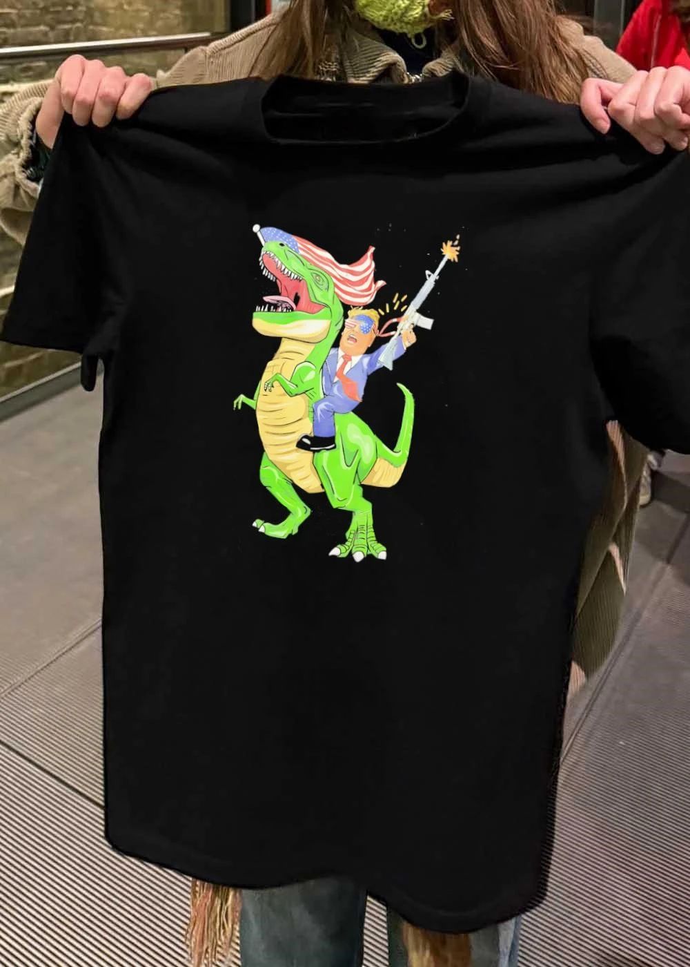Patriotic Apparel Donald Trump Riding T-Rex Firing Rifle shirt