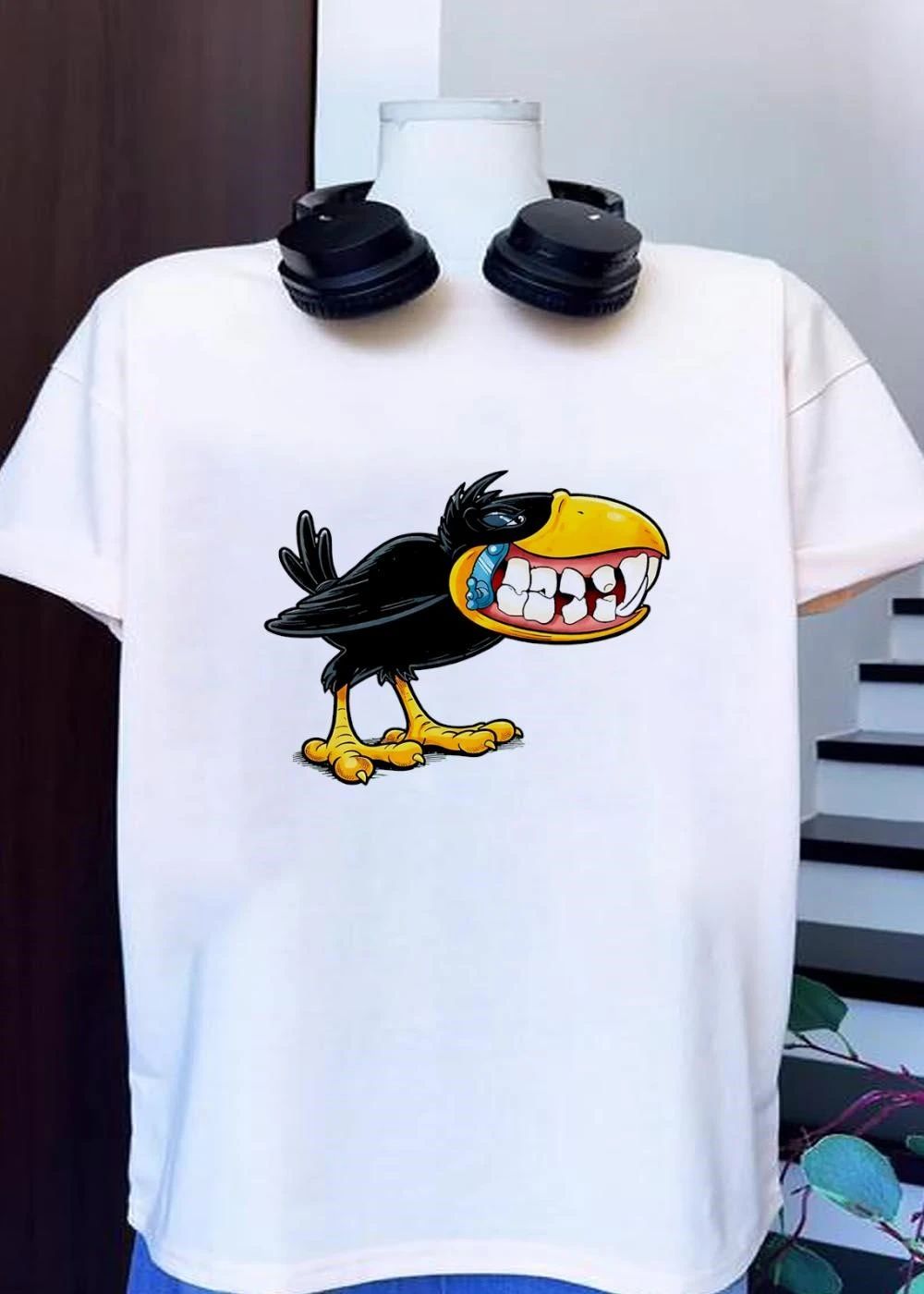 Crow with Teeth and Blue Phone Cartoon Graphic Green Background T-Shirt
