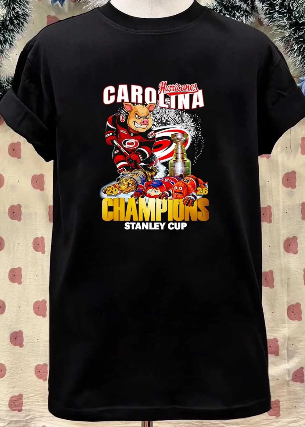 2026 Champions Carolina Hurricanes Mascot Defeating Rivals Stanley Cup T-Shirt