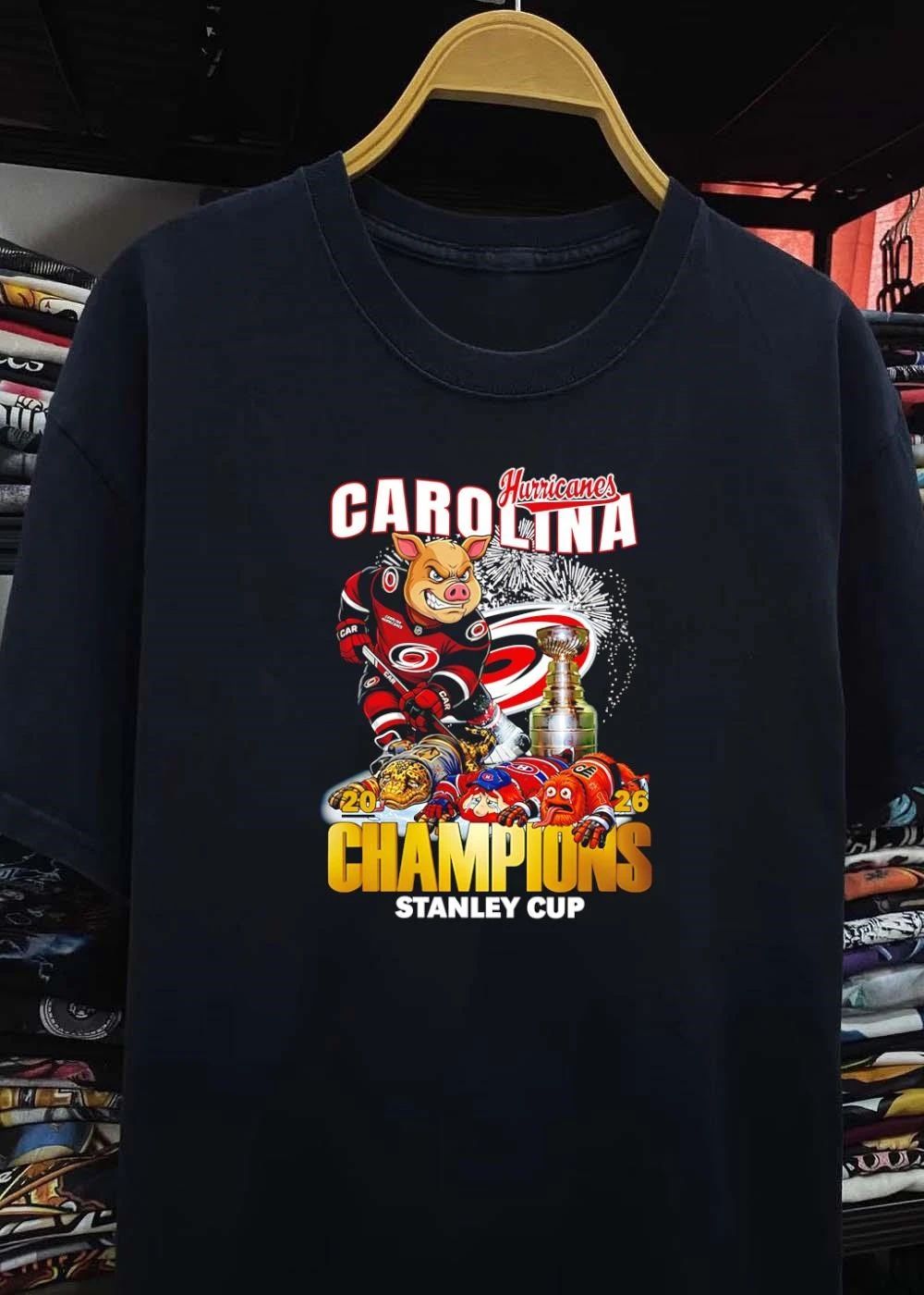 2026 Champions Carolina Hurricanes Mascot Defeating Rivals Stanley Cup T-Shirt