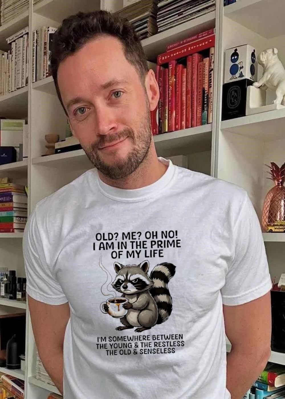 Funny Raccoon Holding Coffee Mug Old Me Oh No I Am In The Prime Of My Life I Am Somewhere Between The Young The Restless Old Senseless T-Shirt